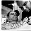 photographing myself getting tattooed