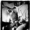 Tommy Helm tattooing my thigh