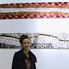  artist Maria Creyts in front of two new photo friezes at her exhibit "lacey" -- which continues through November 29th at Pi gallery
