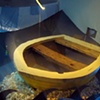 Michael Louis Young
"S.O.S. / S.O.L." 
Installation featuring cardboard ship titled "Sinking Thinking"