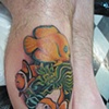 Fish over fish tattoo
