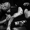 Criminal tatting up Evil.