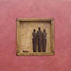 Three Figures with Stone