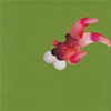 paper lure (red/white spheres and pink tentacles on green)
