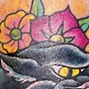 panther head with flowers tattoo