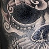 skull with vines half sleeve tattoo