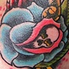 rose and wing neck tattoo