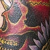 red skull with wings tattoo