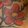 cherry blossoms with om symbol tattoo