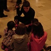 Lolly Extract in a Circle of Curious Little Field Museum Members