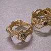 Twisted Wire Rings. 18kt. Garnet. Emerald.