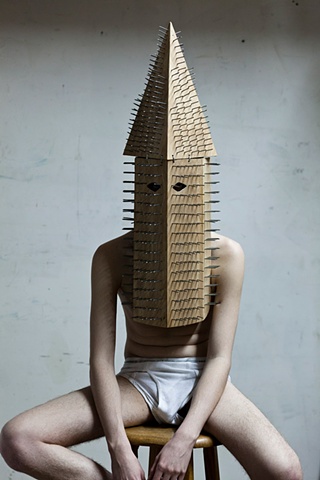 Wood and nail KKK hood