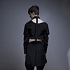 Back of black seamed puzzle shirt