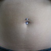Navel Piercing with Faceted Gem Barbell 