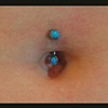 Navel Piercing with Turquoise Curved Barbell