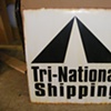 Tri National shipping sign