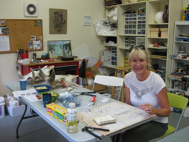 Student enjoying a mosaic lesson