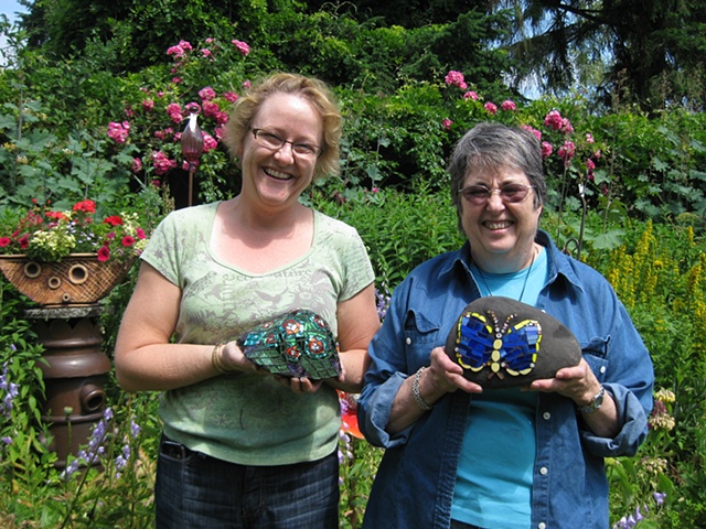 Students with finished mosaic garden art 