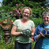 Students with finished mosaic garden art 