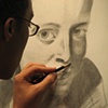 B. Rodriguez working on a graphite drawing