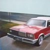 El Camino in Red with Camper