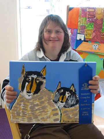 Vicki Dominion with a blue ribbon for
"Vicki and Mike"
