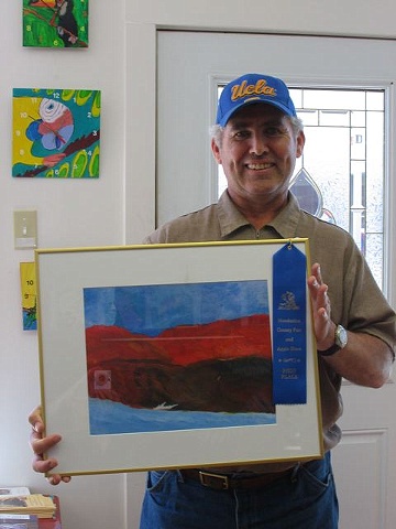 Mike Barnes with a blue ribbon for
"Winter Light"