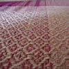 Cochineal-dyed organic cotton cloth for pillow cases on the loom