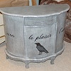 French table in gray wash with text and crow detail 
