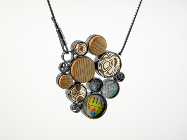 sterling silver pendant with wood, maps, and mokume gane