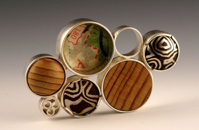 Seven Disc Cluster Pin