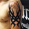 Tribal with a "Tap Out" logo