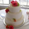 white fondant wedding cake w/ fresh flowers