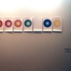 installation view: 'Bite' showing 'Glow: Every Colour of Car Underlighting Neon Made by GroundEffects' drawings