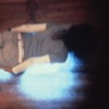 video still: Me On Neon from interior of A 1:16 Scale Model of The Temporary Katie Centre...