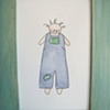 bluegreen curly headed boy in ocean green frame

