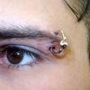 eye brow piercing by tatupaul