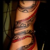 snake on foot tattoo by tatupaul
