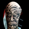 evil face tattoo by tatupaul.com