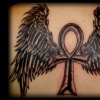 ank with wings tattoo by tatupaul
