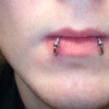 snake bite piercing by tatupaul