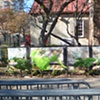 Digitally-printed banners installed on the front fence of the Old Stone House