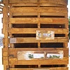  Installation "Pallet City Plein-Air" by Katherine Gressel, as part of the Pallet City "exhibit" space. Paintings of views through "Pallet City," done onsite at Governors Island, Acrylic on found wood, 2010