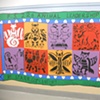 Detail, animal totem stencils. Each small group of students created its own hybrid drawing as a team, which was translated into a stencil by the artist.