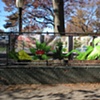 Digitally-printed banners installed on the front fence of the Old Stone House