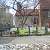 Digitally-printed banners installed on the front fence of the Old Stone House