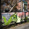 Digitally-printed banners installed on the front fence of the Old Stone House
