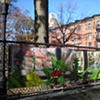 Digitally-printed banners installed on the front fence of the Old Stone House