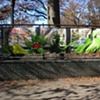 Digitally-printed banners installed on the front fence of the Old Stone House