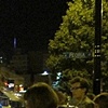 The Bear and Seance Table on the streets of Chicago.. Seance participants finely dressed.